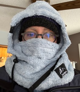 Rachel's face bundled up in a lot of gray winter gear