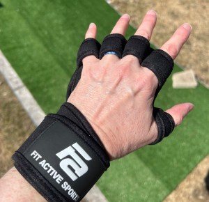 Black finger support glove on a hand